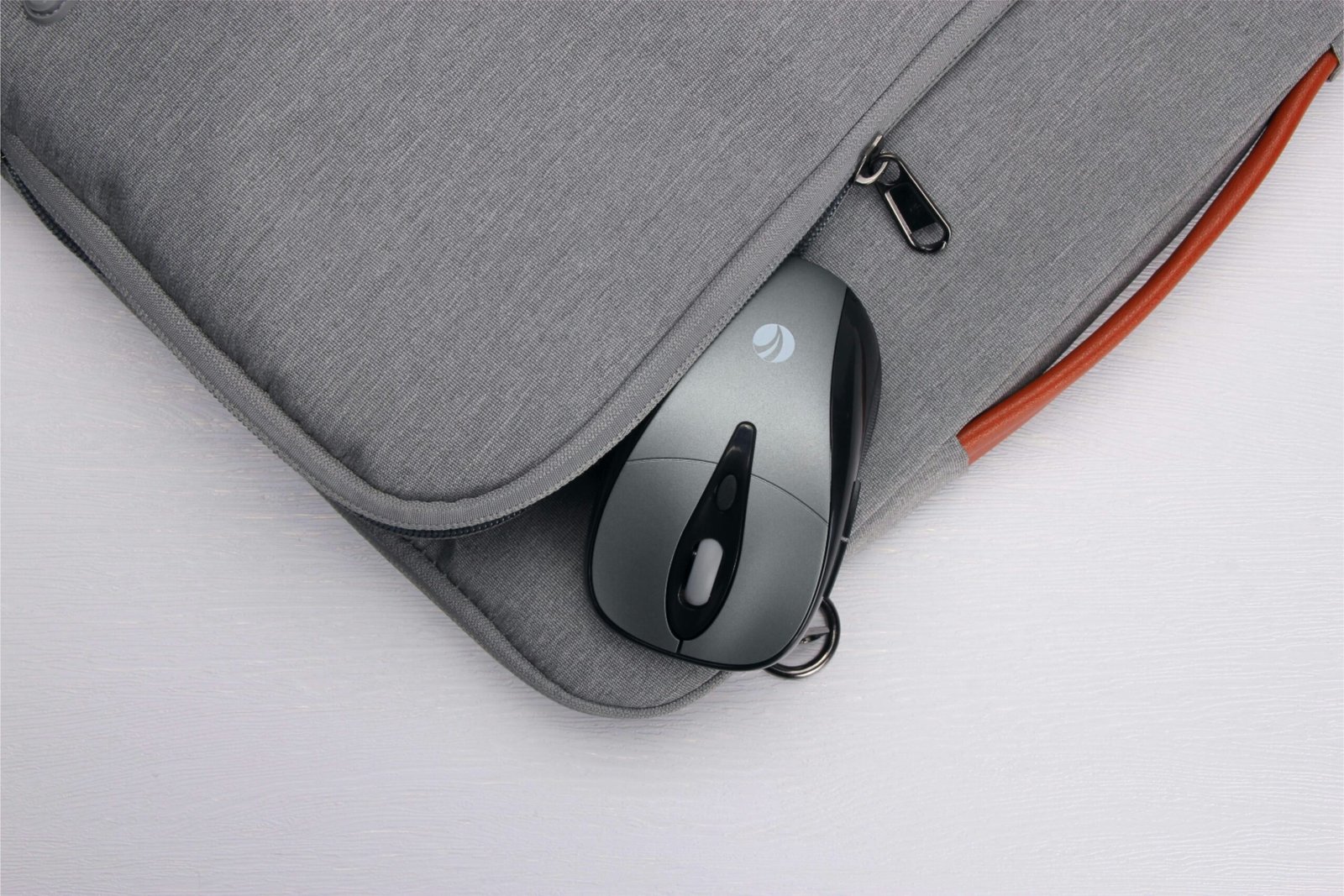 A computer bag with a computer mouse in it